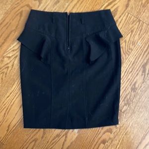 Black, polyester skirt with zipper.